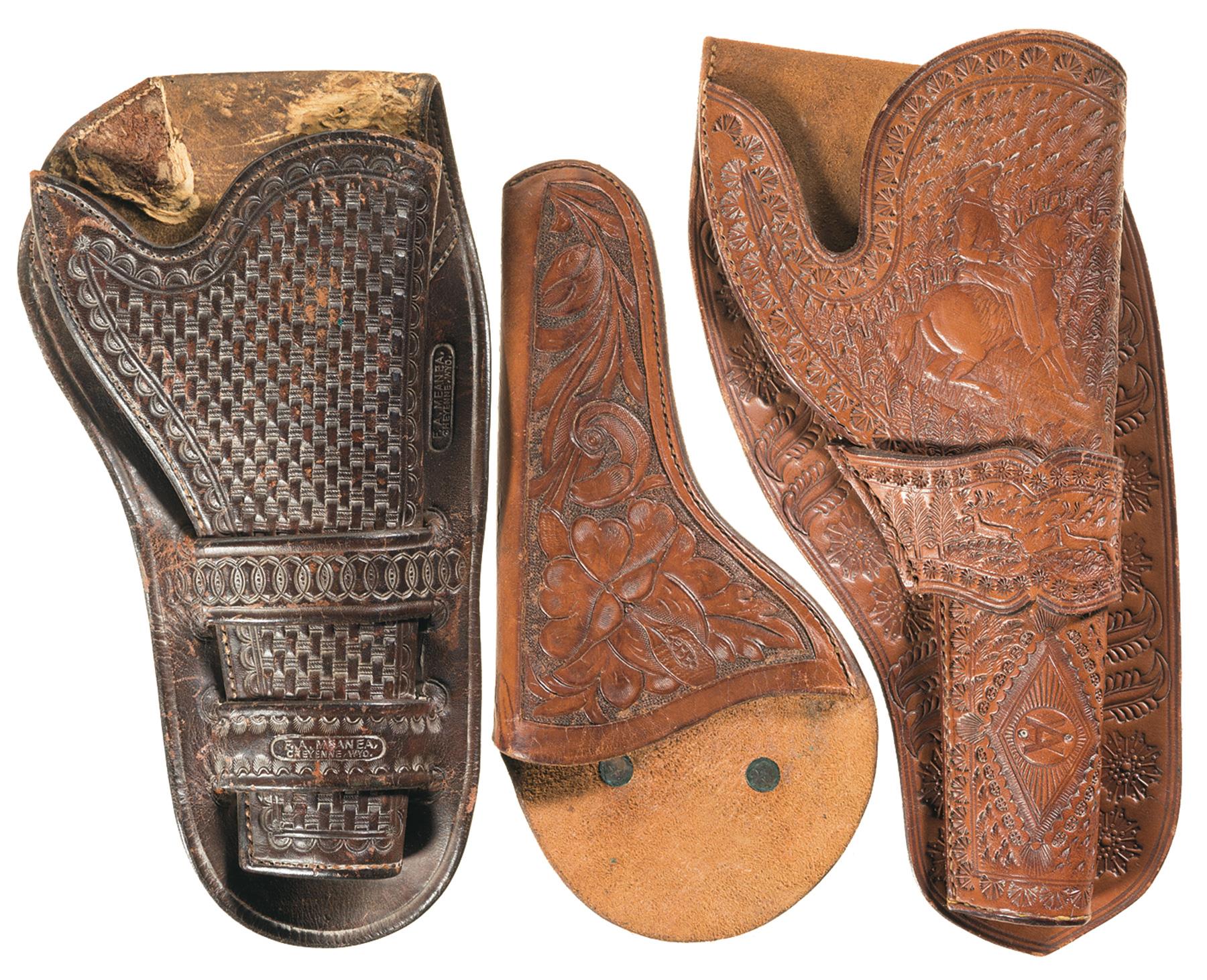 Three Tooled Leather Holsters | Rock Island Auction
