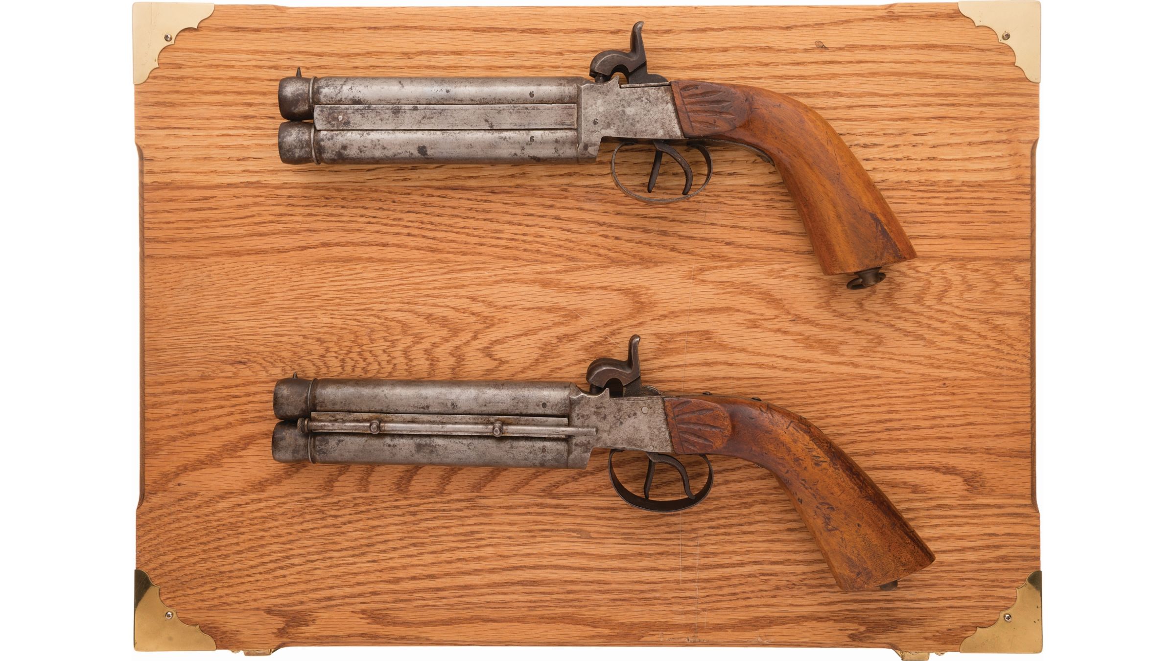 Cased Pair of Boxlock Over/Under Percussion Pistols | Rock Island Auction