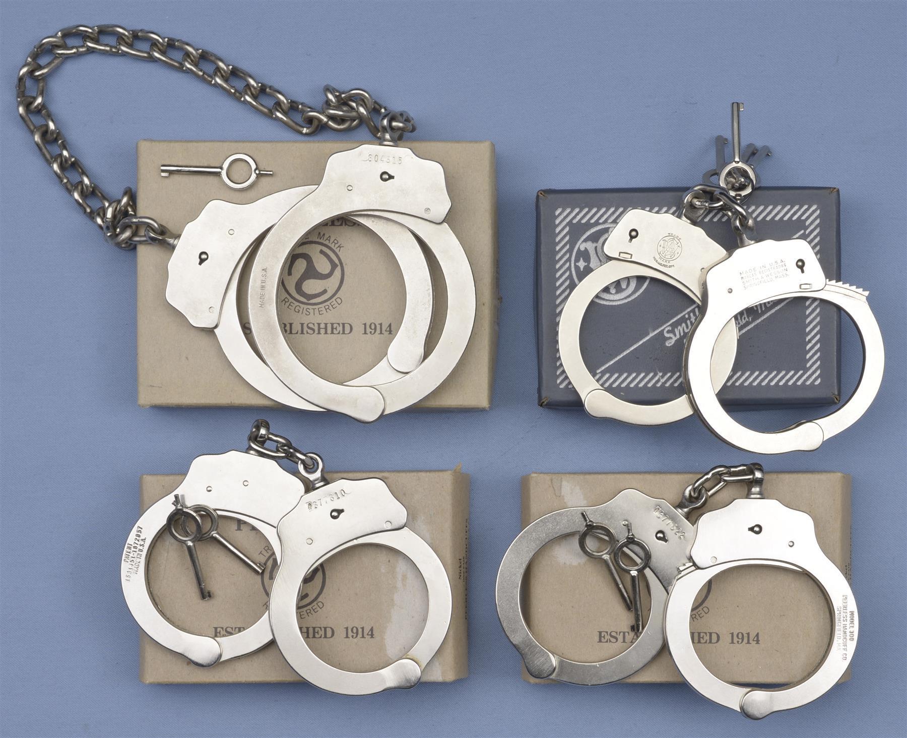 Three Pairs of Handcuffs and One Pair of Leg Irons with Boxes Rock