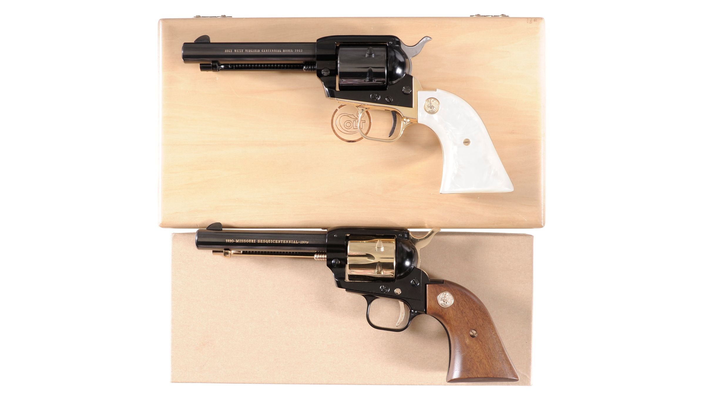 Two Colt Frontier Scout Commemorative Single Action Revolvers Rock