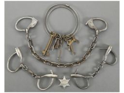 Two Sets of Vintage Handcuffs and One Set of Leg Shackles