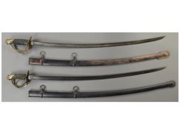 Two U.S. Cavalry Swords with Scabbards