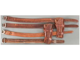 Four Leather Cartridge Belts and Two Holsters