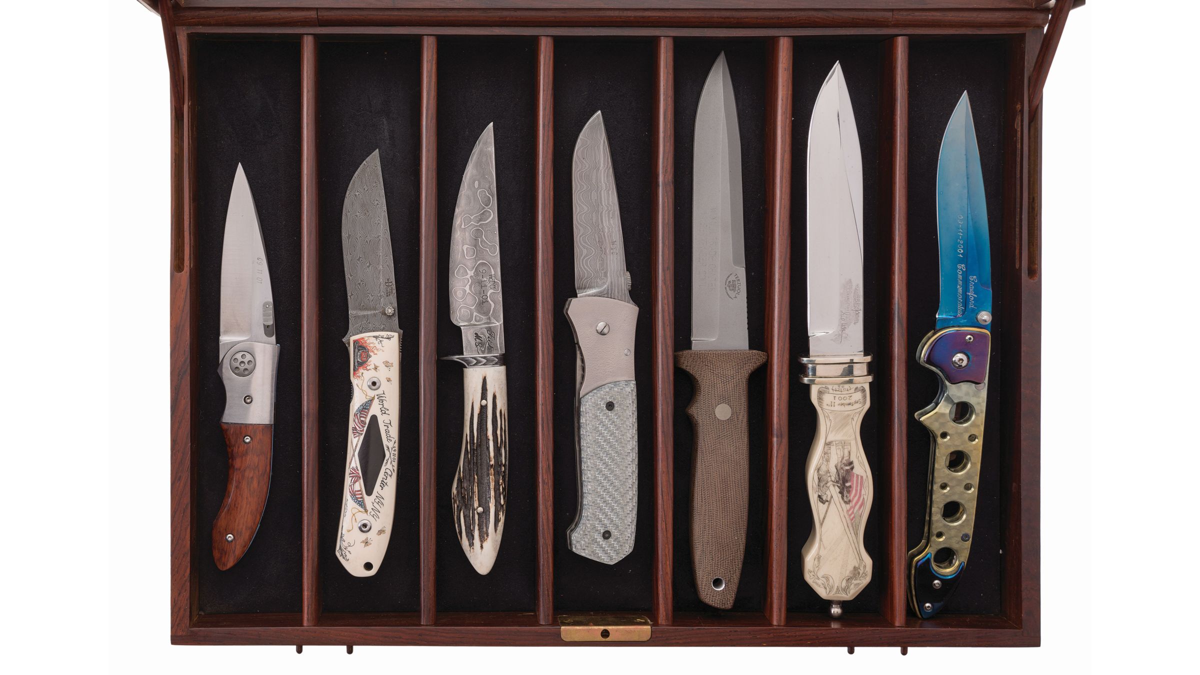 Hunting and fishing knives collection in wall display ca…