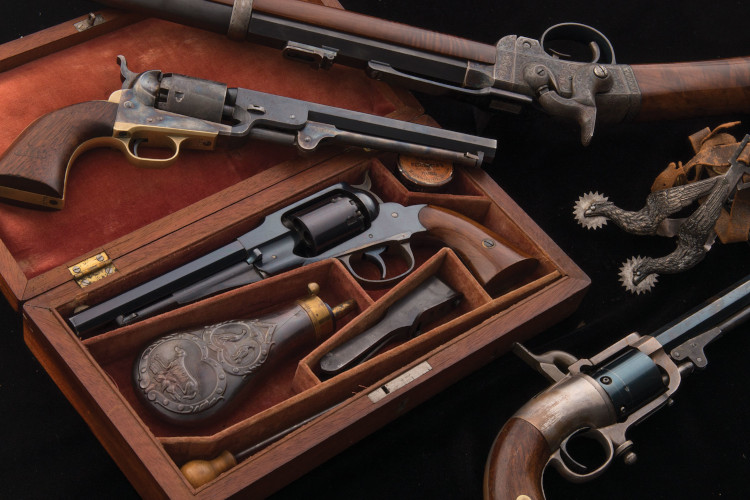Antique pistols and a set of spurs