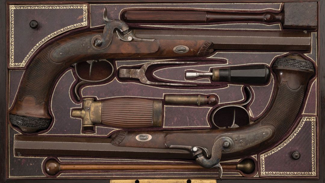 Cased-Pair-of-Engraved-and-Gold-Inlaid-Percussion-Dueling-Pistols-by-LePage-Dated-1836