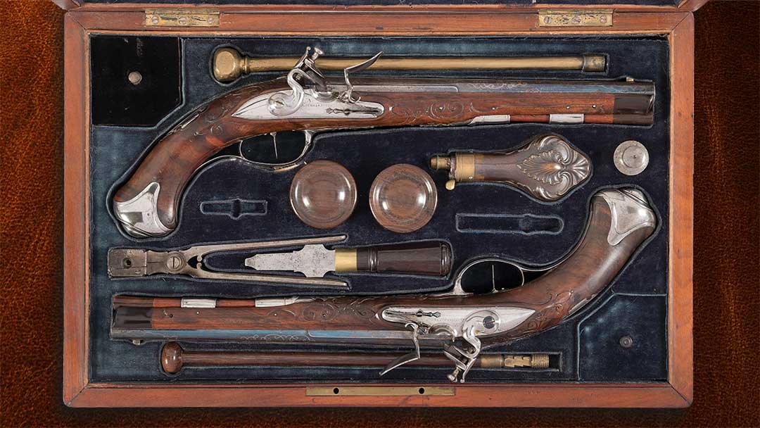 Cased-Pair-of-Silver-Inlaid-Johann-Andreas-Kuchenreuter-Flintlock-Pistols