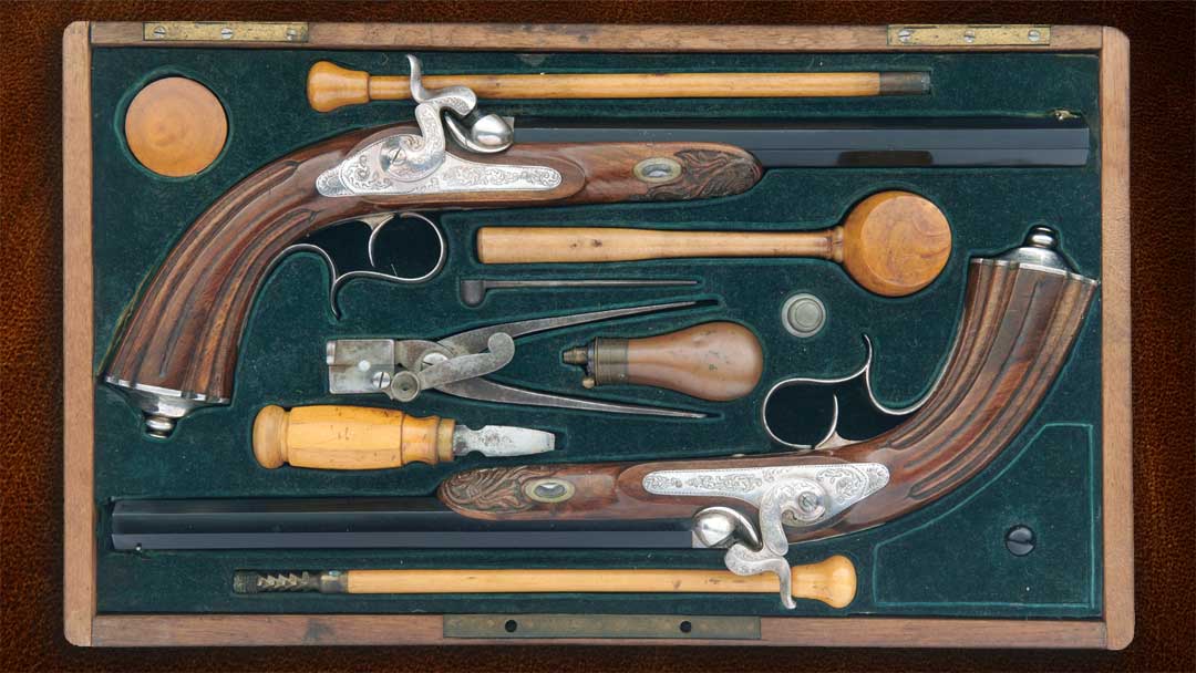 Cased-Pair-of-Engraved-and-Carved-French-Dueling-Pistols