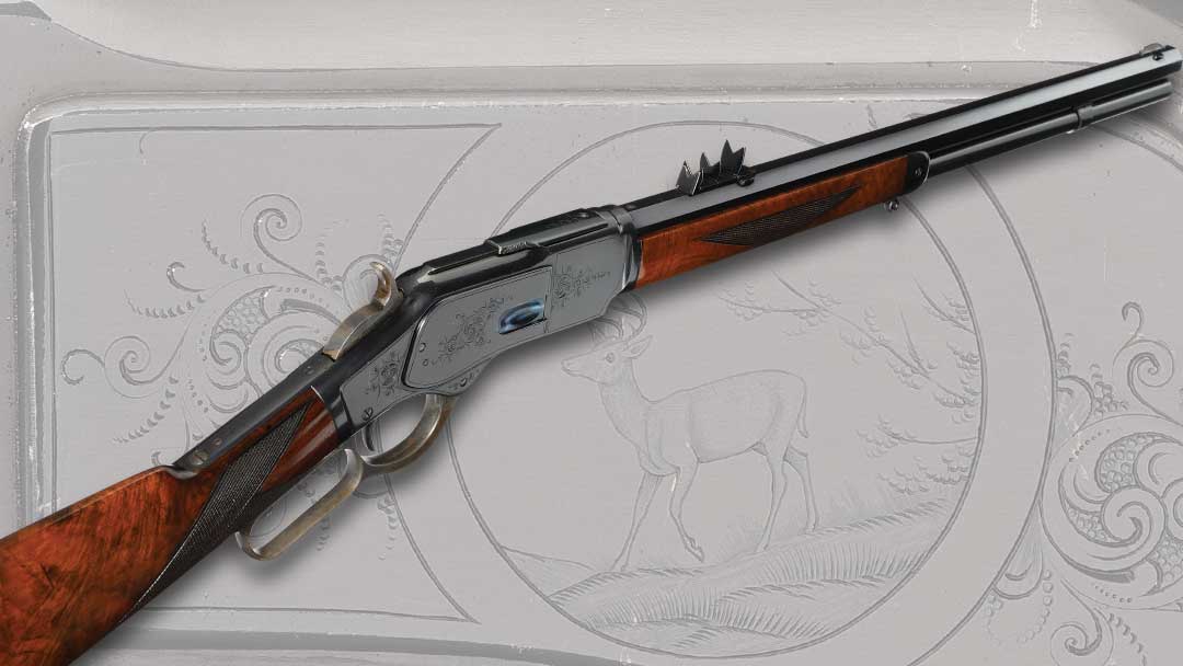 An extremely rare factory exhibition engraved Winchester Deluxe Model 1873 short rifle that was photographed in the Winchester Engraving Book