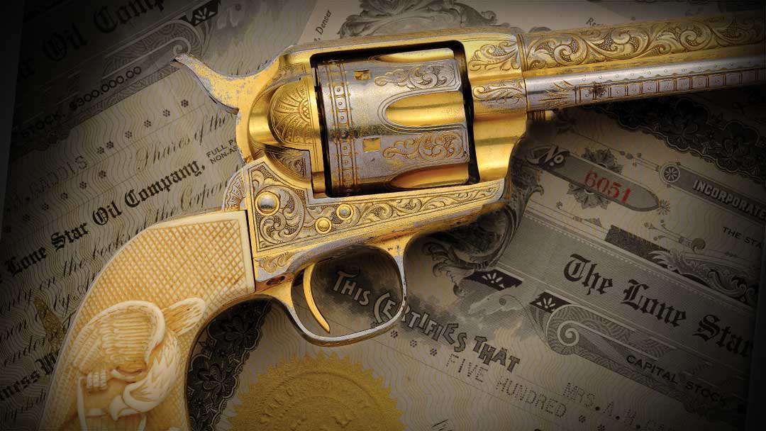 A gold-plated, engraved, early antique black powder frame Colt SAA revolver with a carved eagle grip.