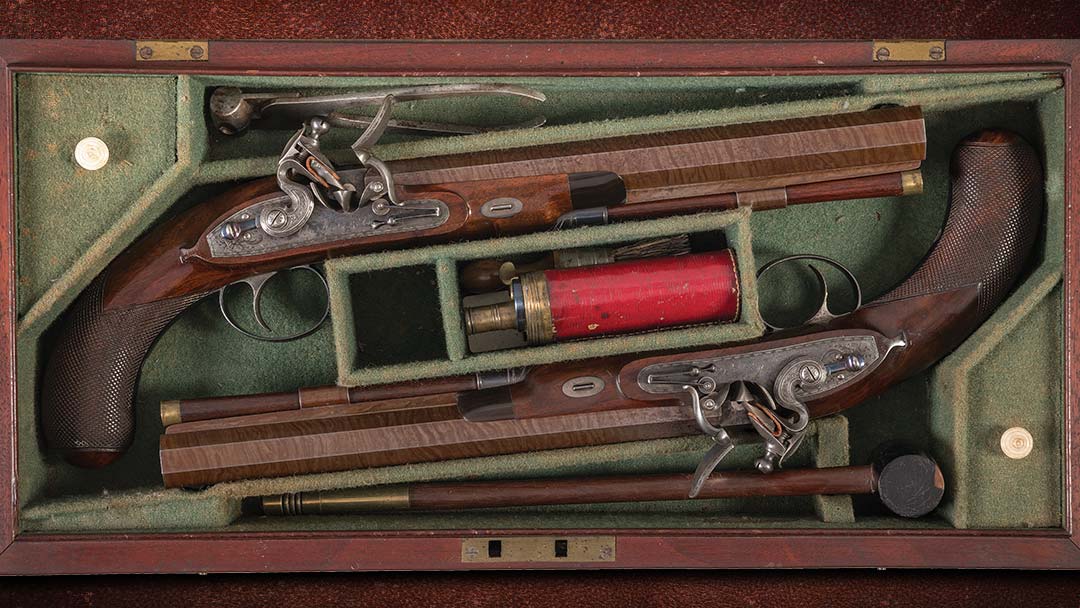 A-fine-cased-pair-of-engraved-John-Manton-and-Son-rifled-half-stock-flintlock-dueling-pistols-from-1816