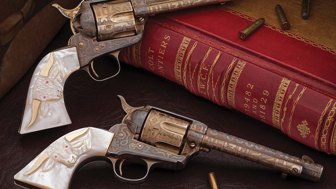 two-cattle-brand-engraved-colt-single-action-army-revolvers