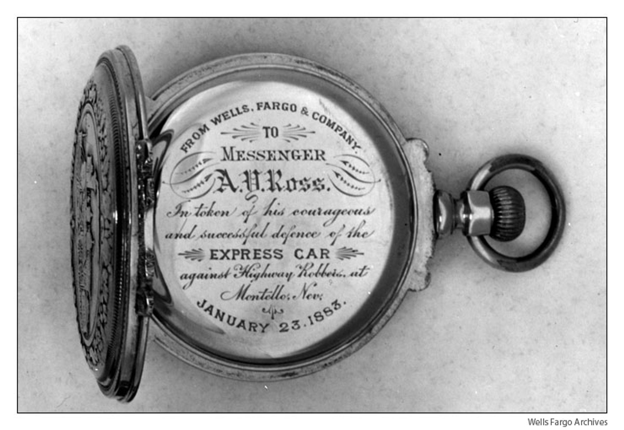 The pocket watch given to Ross and its inner inscription. 