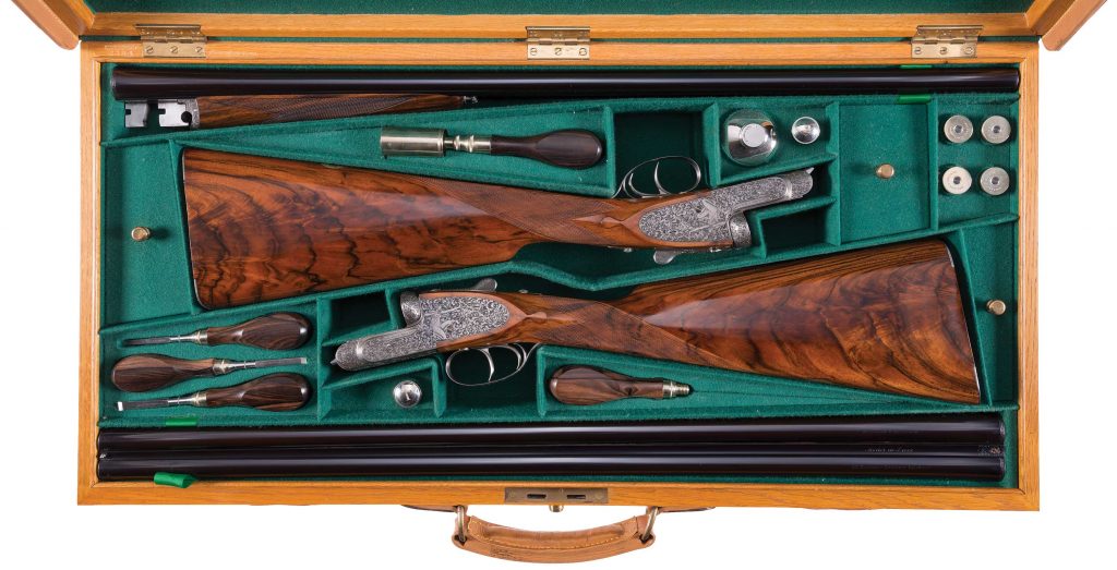 cased pair engraved Holland & Holland shotguns