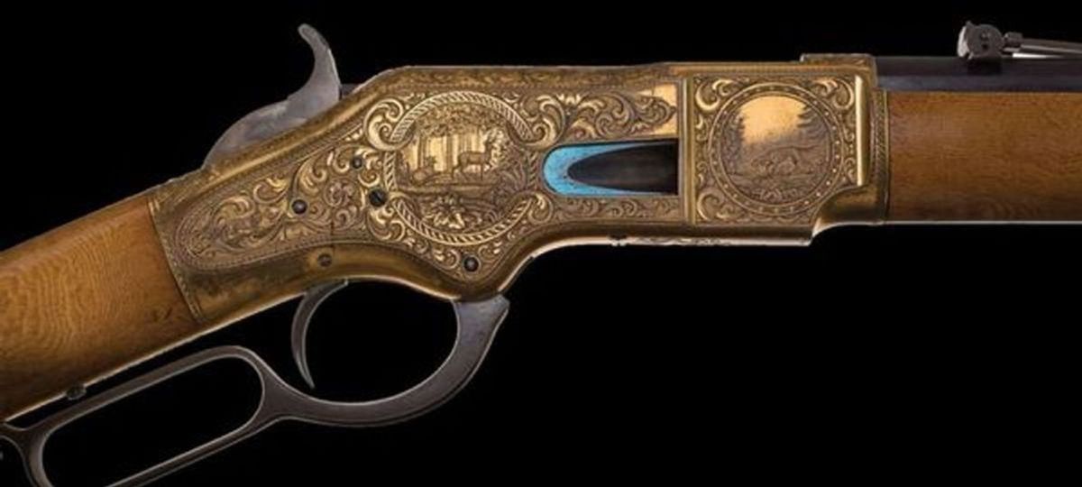 This is the stunning, documented factory panel scene engraved, gold plated, maple stocked and cased Winchester Deluxe Model 1866 Factory "On The Rocky Mountains" display lever action rifle. The beautiful rifle sold for $598,000 in May of 2017.