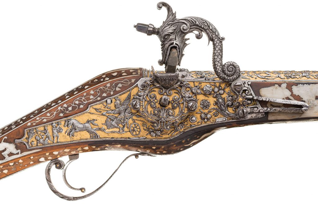 Lot 1272: An Extremely Rare and Magnificent Wheellock Holster Pistol with Superbly Chiseled and Gilt Steel Mounts by Emanuel and/or Daniel Sadeler Royal Gunmakers to HRH Duke William of Bavaria Circa 1605