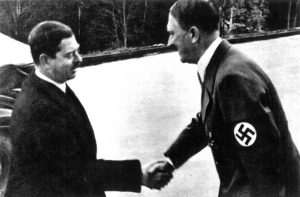 Adolf Hitler shaking Georg Luger's hand.