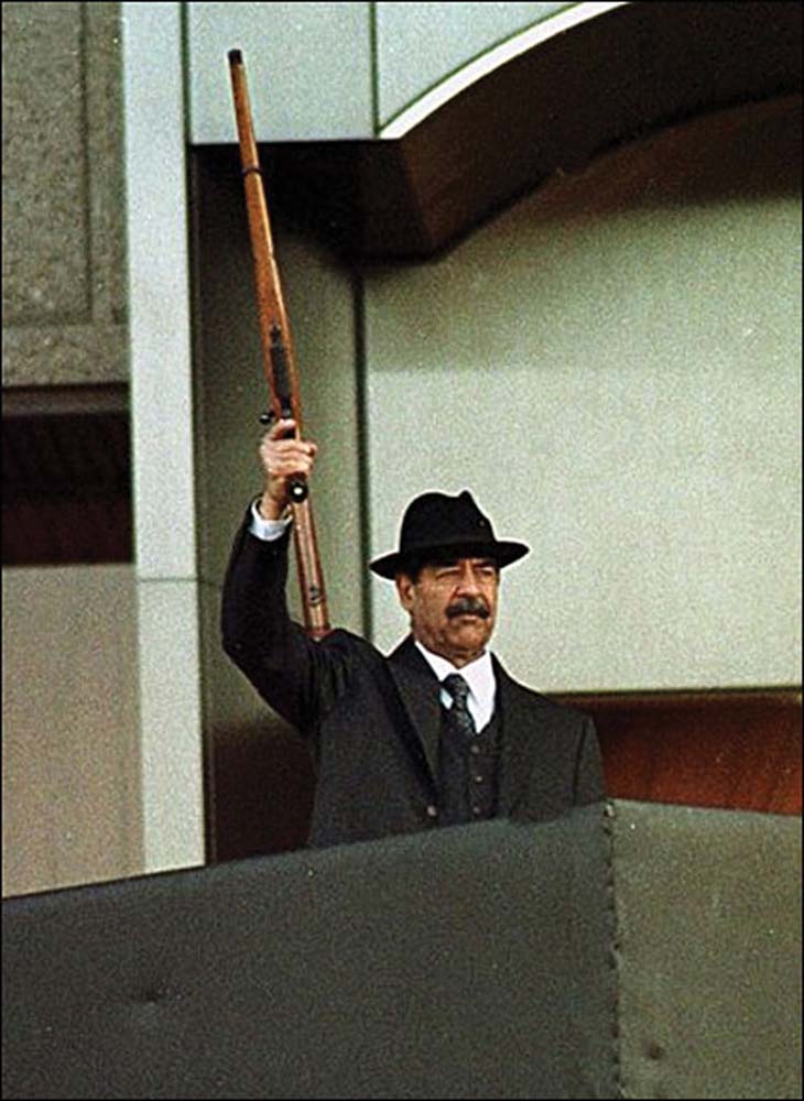 Saddam Hussein Holding His Ruger