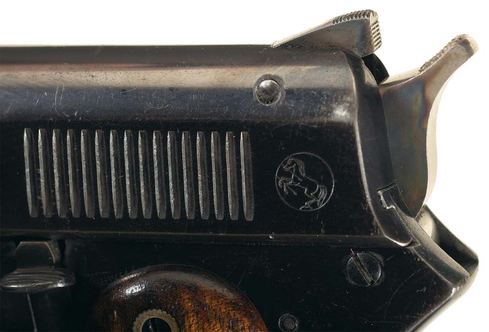 Showing a close up of the sight safety and a inconspicuous looking slide release lever at lower left.