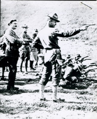 "Firing the Automatic, a snapshot somewhere in France."  Here, a Marine demonstrates the 1911 for the French in a well-known 1918 photo.  Goddard notes in his book that, "In the Sunday Globe Magazine, it illustrated an article entitled, "Eight Million Shots Ready for the Hun."
